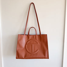 Load image into Gallery viewer, Telfar Large Faux Leather Embossed Logo Snap Closure Crossbody Bag Brown