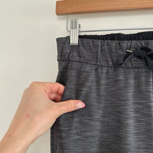Load image into Gallery viewer, Lululemon On The Fly Drawstring Waist Pants in Heathered Black 4
