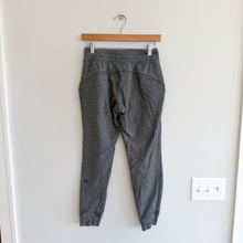 Load image into Gallery viewer, Lululemon Warm Down Jogger II Pant in Heathered Speckled Black 4
