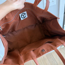 Load image into Gallery viewer, Telfar Large Faux Leather Embossed Logo Snap Closure Crossbody Bag Brown
