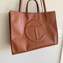 Load image into Gallery viewer, Telfar Large Faux Leather Embossed Logo Snap Closure Crossbody Bag Brown
