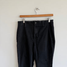 Load image into Gallery viewer, We The Free Raw Hem Denim High Rise Flared Jeans Black 30
