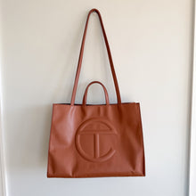 Load image into Gallery viewer, Telfar Large Faux Leather Embossed Logo Snap Closure Crossbody Bag Brown
