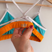 Load image into Gallery viewer, Alo Westerly Colorblock Crisscross Strap Sports Bra Turquoise Orange
