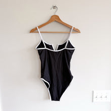 Load image into Gallery viewer, Skota Swim Amor Notch Neckline Adjustable Strap One Piece Swimsuit Black L NWT
