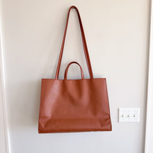 Load image into Gallery viewer, Telfar Large Faux Leather Embossed Logo Snap Closure Crossbody Bag Brown
